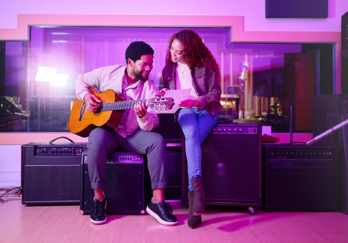 Musicians collaborating in a recording studio.